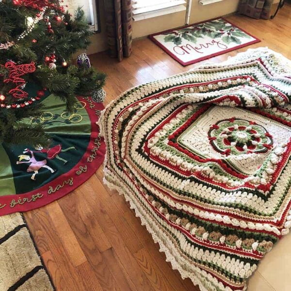 Shades of green, cranberry, toasted almond square blanket