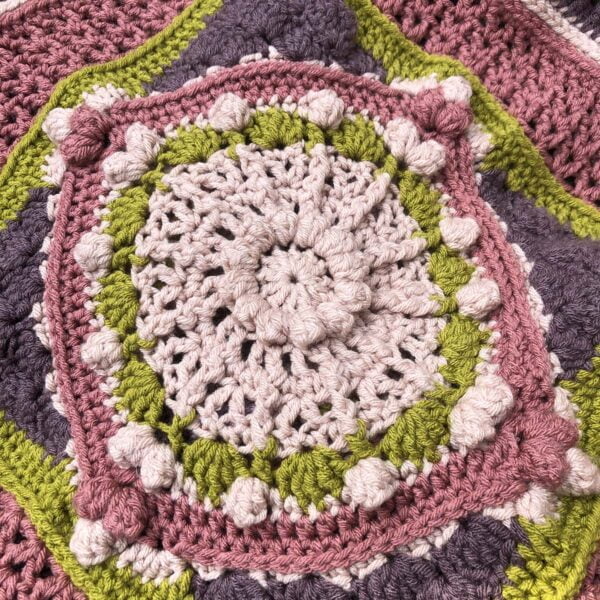 Mandala blanket showcasing pink centerpiece